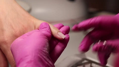 Cuticle trimming with scissors during manicure treatment Stock Footage 308516524