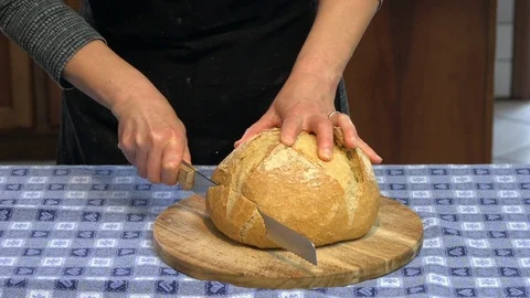Cuting bread handmade Stock Footage 90377605