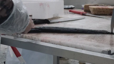 Cuting the eel Stock Footage 90086654