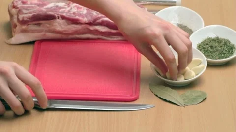 Cuting garlic into thin strips on chopping board Video stock 7740891