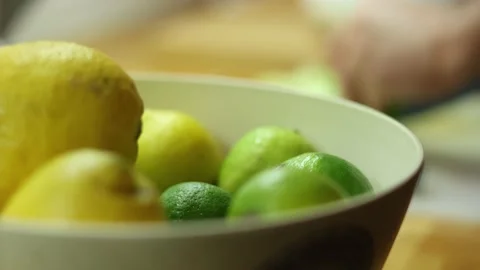 Cuting lemons and lime for a drink Video stock 231897250