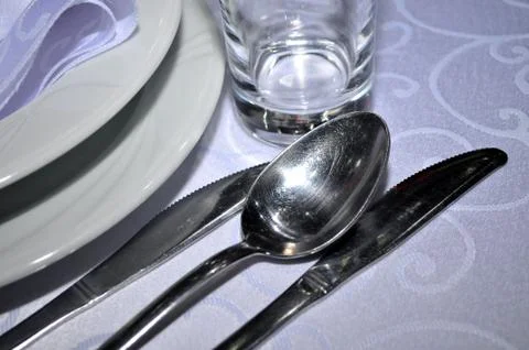 Cutlery are placed at round tables for the guest's traditional weddings, Novi Stock Photos