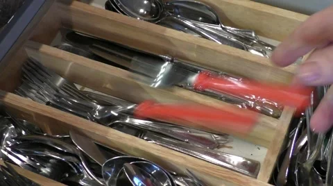 Cutlery being placed in the drawer Stock Footage 46195126