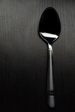 Cutlery on a black table 스톡 사진