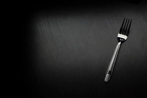 Cutlery on a black table 스톡 사진