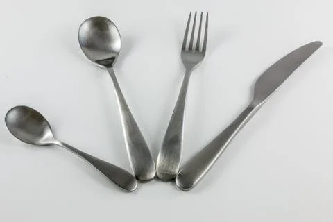 Cutlery with knife, fork, table spoon and little spoon Stock-Fotos