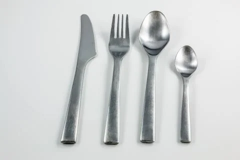 Cutlery with knife, fork, table spoon and little spoon Stock-Fotos