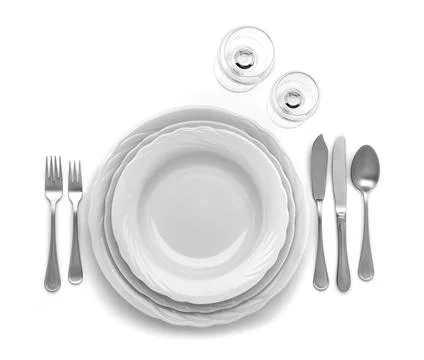 CUTLERY SET ON WHITE TABLE Stock Photos
