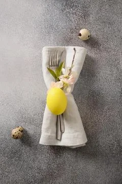 Cutlery with spring decorations for Easter table setting. Stock Photos