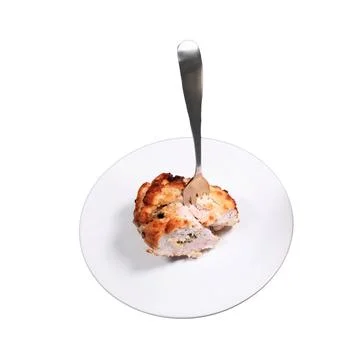 Cutlet with a fork, isolated on a white background. Plate with cutlet in Ki.. Stock Photos