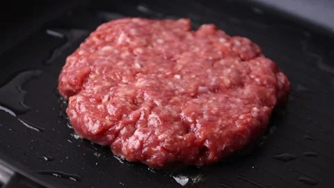 The cutlet is fried in a frying pan Stock Footage 176390126
