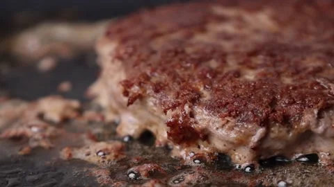 The cutlet is fried in a frying pan Stock Footage 176390212