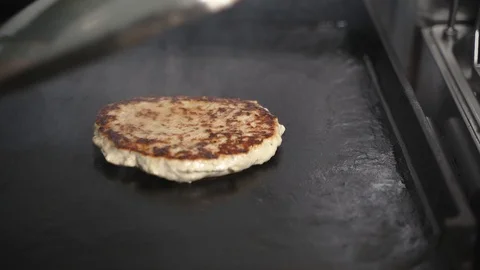 The cutlet is fried in a pan Stock Footage 129685473