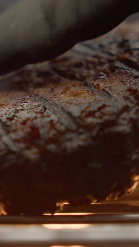 The cutlet is grilled over an open fire vertical video 스톡 동영상 310955803