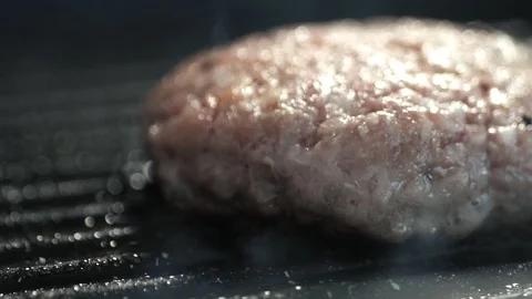 From cutlet lying on the grill comes a light appetizing aroma of roasted meat Stock Footage 113202828