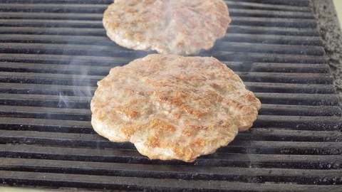 Cutlet of pork fried on a grill to make hamburgers Stock Footage 120748254