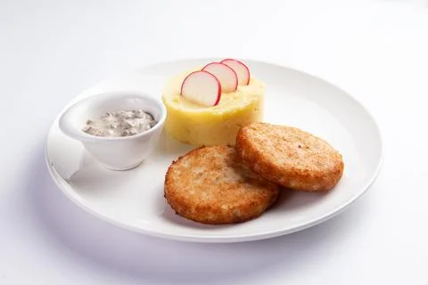 Cutlets and mashed potatoes in a plate. Stock Photos
