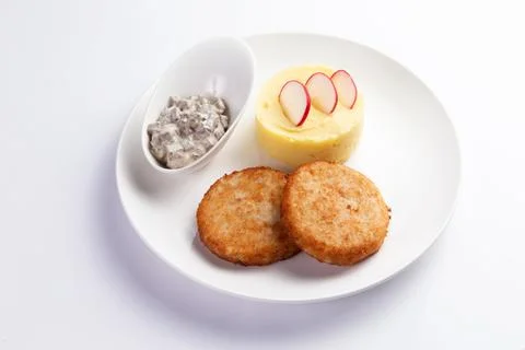 Cutlets and mashed potatoes in a plate. Stock Photos