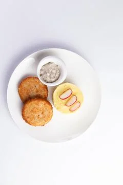 Cutlets and mashed potatoes in a plate. Stock Photos