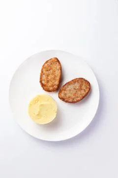 Cutlets and mashed potatoes in a plate. Stock Photos