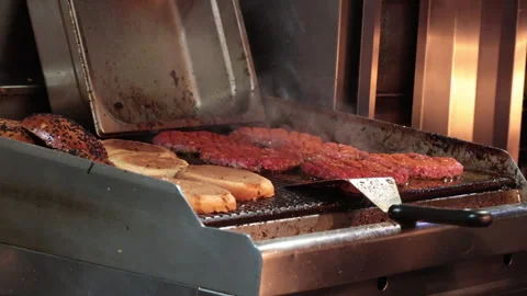 Cutlets are being cooked on a dirty grill Stock Footage 267615791