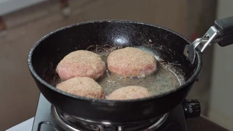Cutlets are fried in a frying pan Stock Footage 142930106