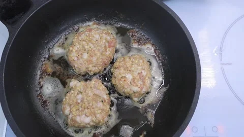 Cutlets are fried in a frying pan Video stock 145685826