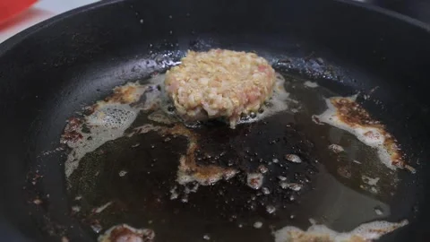 Cutlets are fried in a frying pan Video stock 145685842