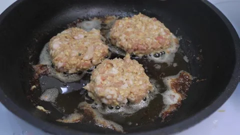 Cutlets are fried in a frying pan Video stock 145889315