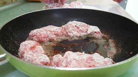Cutlets are fried in a skillet Stock Footage 80880011