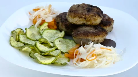 Cutlets with cabbage and zucchini Stock Footage 61913600