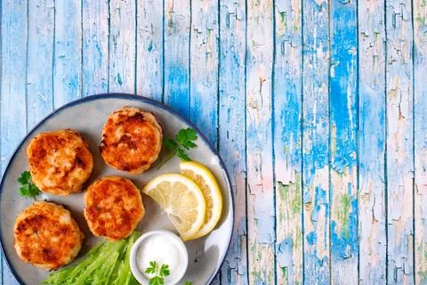 Cutlets with codfish and shrimps served with salad leaves 写真素材
