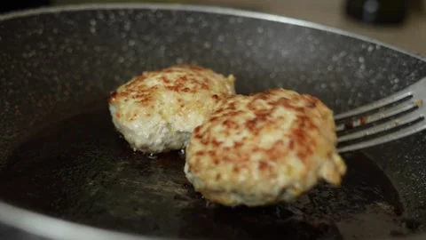 Cutlets fried in a frying pan Stock Footage 267707498