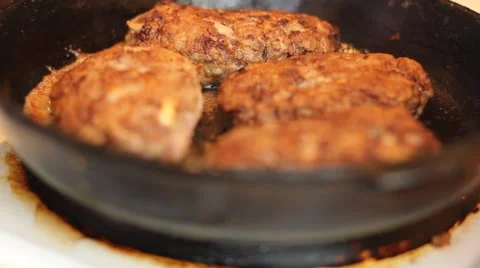 Cutlets fried in a pan Stock Footage 63111131
