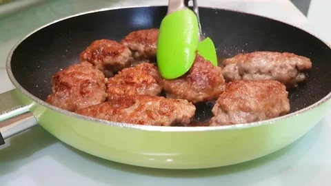 Cutlets fried in a pan Stock Footage 80879974