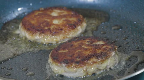 Cutlets frying in pan Stock Footage 59761264