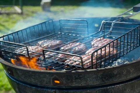 Cutlets on the grill in the garden Stock Photos