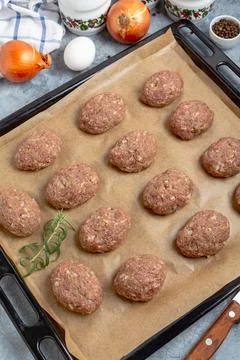 Cutlets made from raw minced meat before baking. Stock Photos