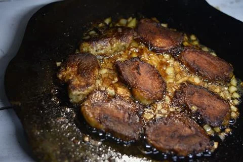 Cutlets pan fried in the fire. pan is also cooking meat Stock Photos