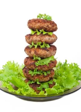 Cutlets on salad leaves Stock Photos