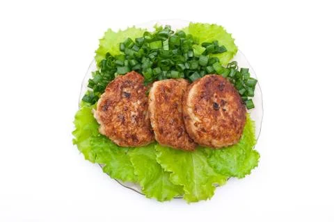 Cutlets on salad leaves Stock Photos