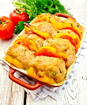 Cutlets of turkey in pan on light board Stock Photos