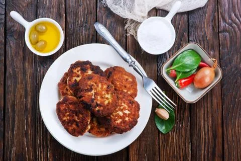 Cutlets on white plate on a table Stock Photos
