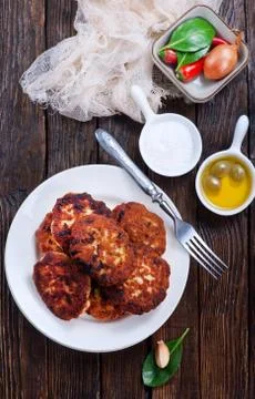 Cutlets on white plate on a table Stock Photos