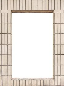 The cutout in the wall for the window is lined with beige ceramic tiles Stock Photos