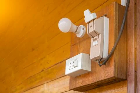 Cutouts and power plugs on old wooden walls Stock Photos