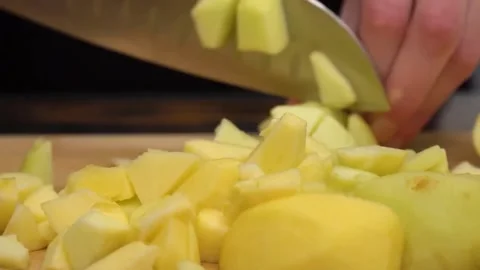 Cuts the apple into small pieces Stock Footage 155298551