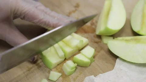 Cuts apples with a knife Stock Footage 146574146