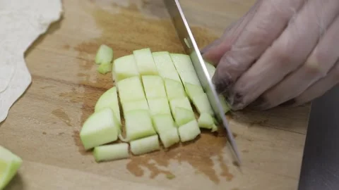 Cuts apples with a knife Stock Footage 146574149