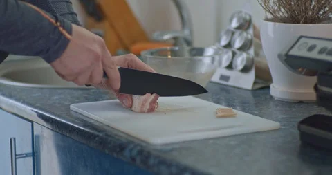 Cuts bacon with a chef's knife Stock Footage 117471036